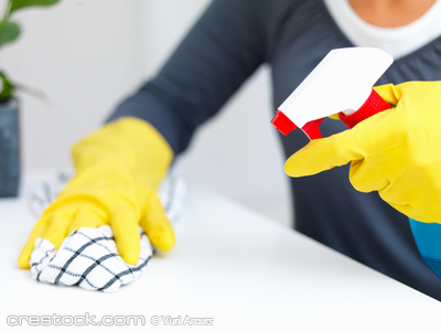 Closeup of cleaners  hands cleaning a table